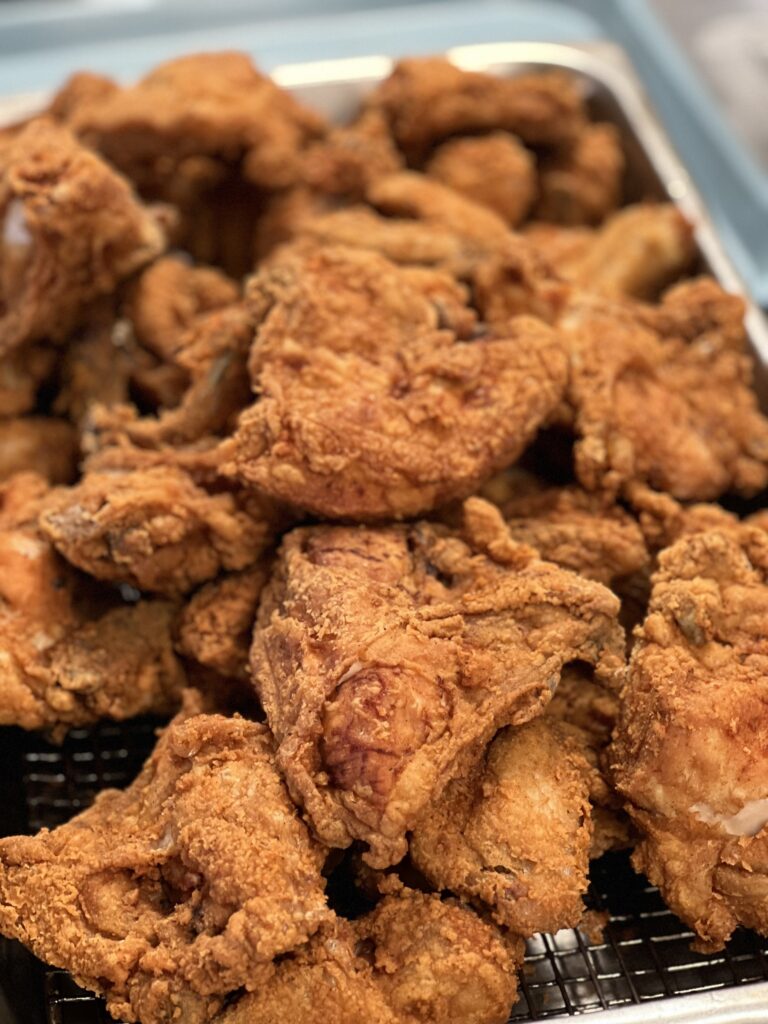 Crispy fried chicken pieces piled high